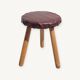Leather-upholstered tripod stool