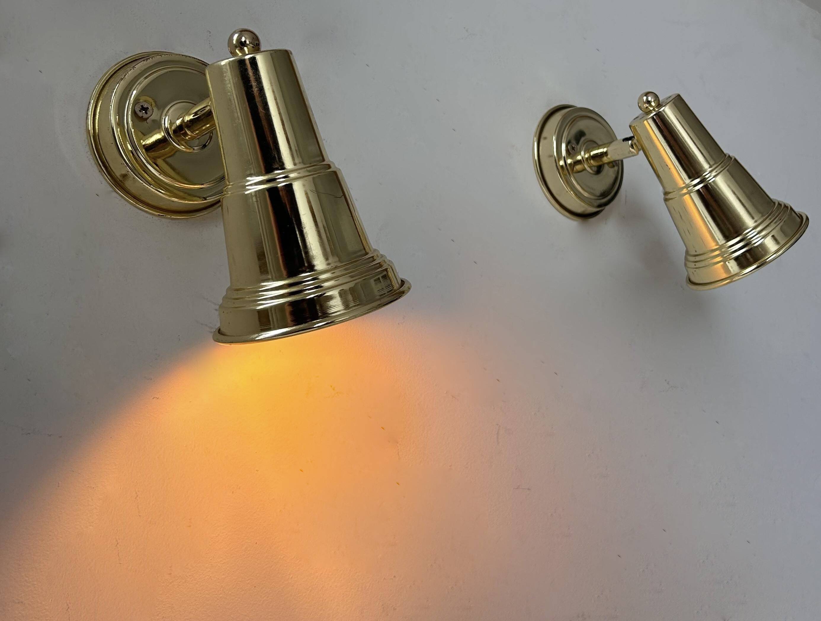 Pair of vintage adjustable wall lights in solid brass, France 1970s