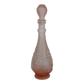 Old pink glass carafe decorated with fruits