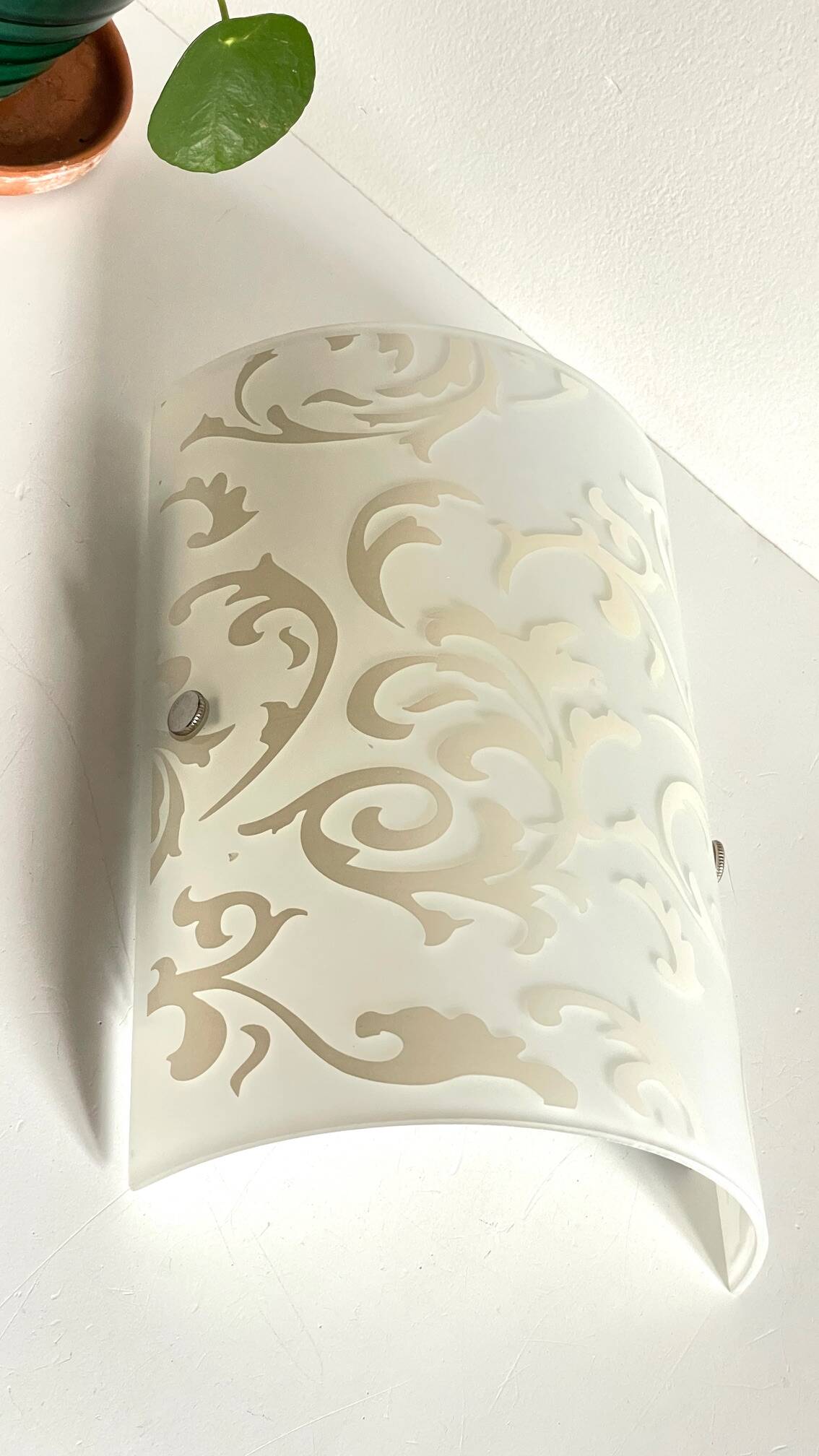 Polished and screen-printed glass sconce by eglo