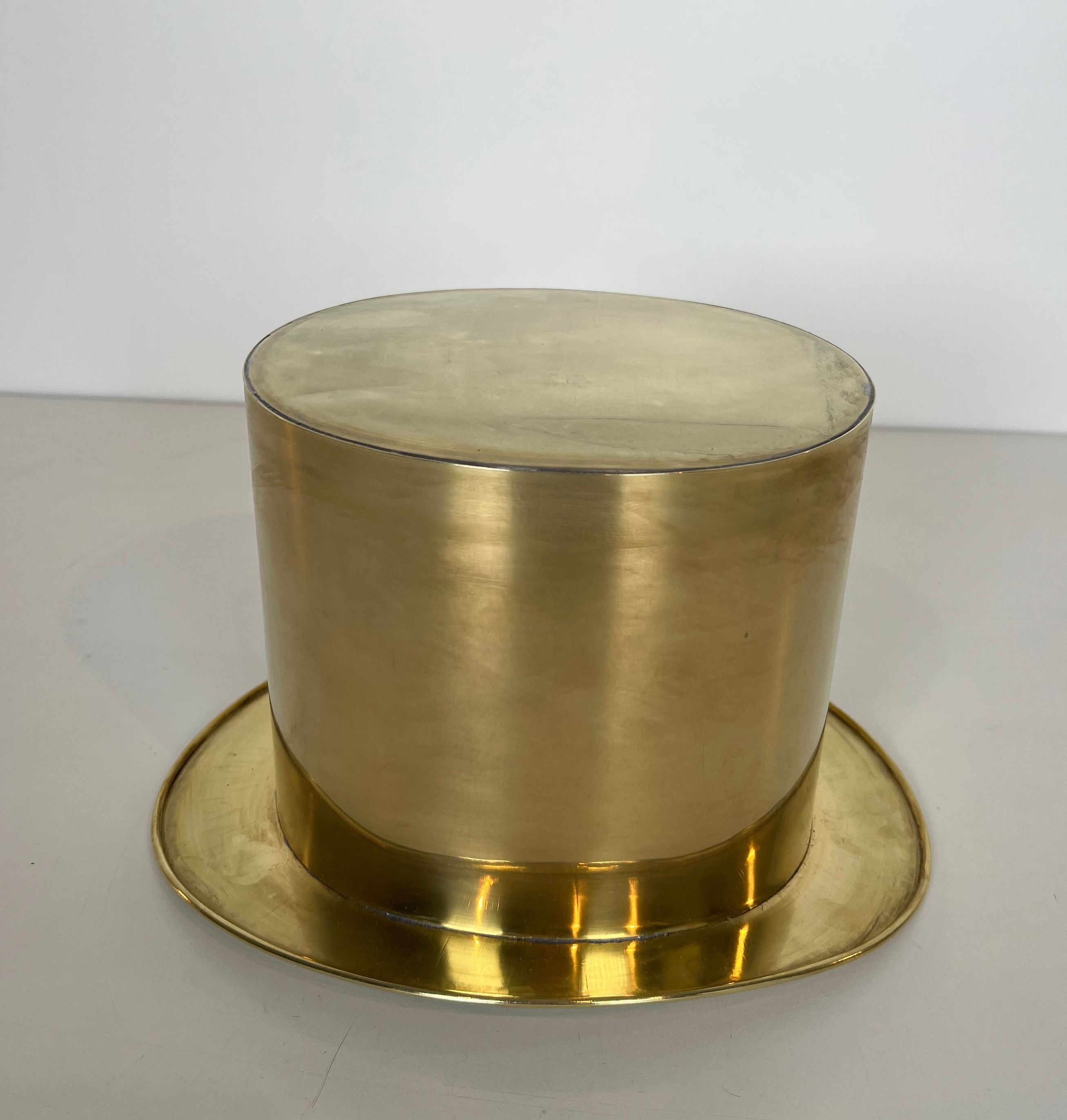 Champagne cooler shaped like a brass top hat.