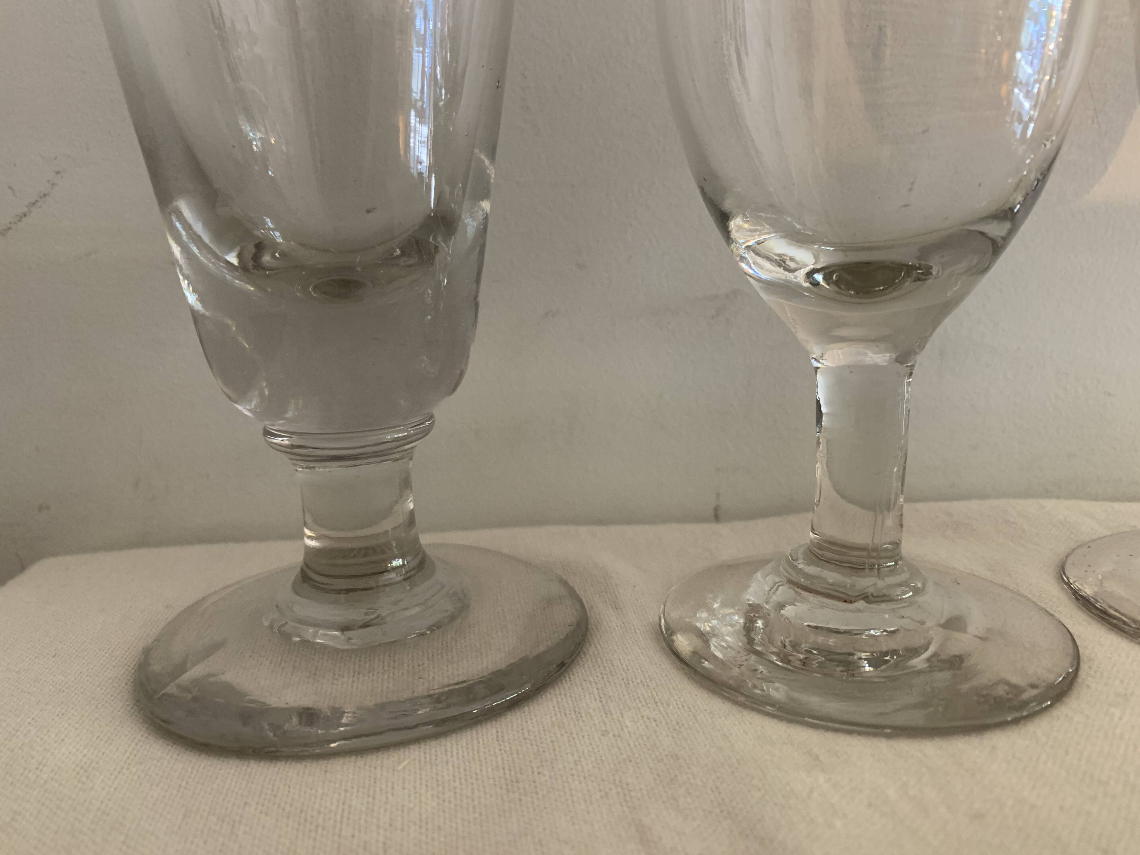 8 old blown and different foot wine glasses