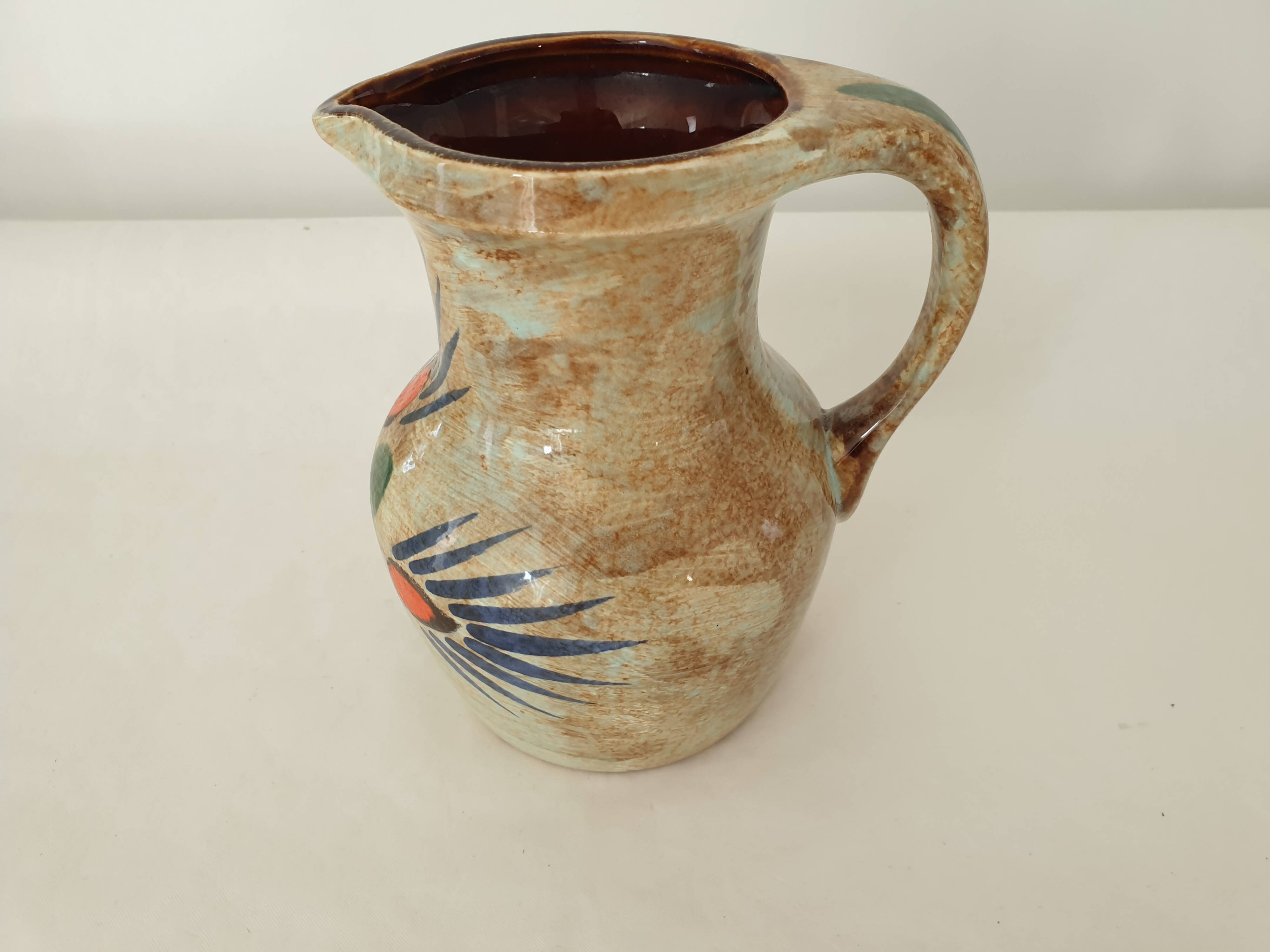 Ceramic pitcher with floral motif signed Saint Clément