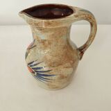 Ceramic pitcher with floral motif signed Saint Clément