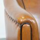 Sheep leather club chair finished with black piping