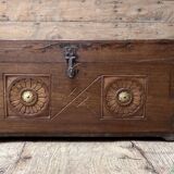 Teak chest from Burma with carved rosettes.