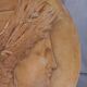 Plaster medallion, high relief, yellow ochre patina, representing the Roman divinity Ceres