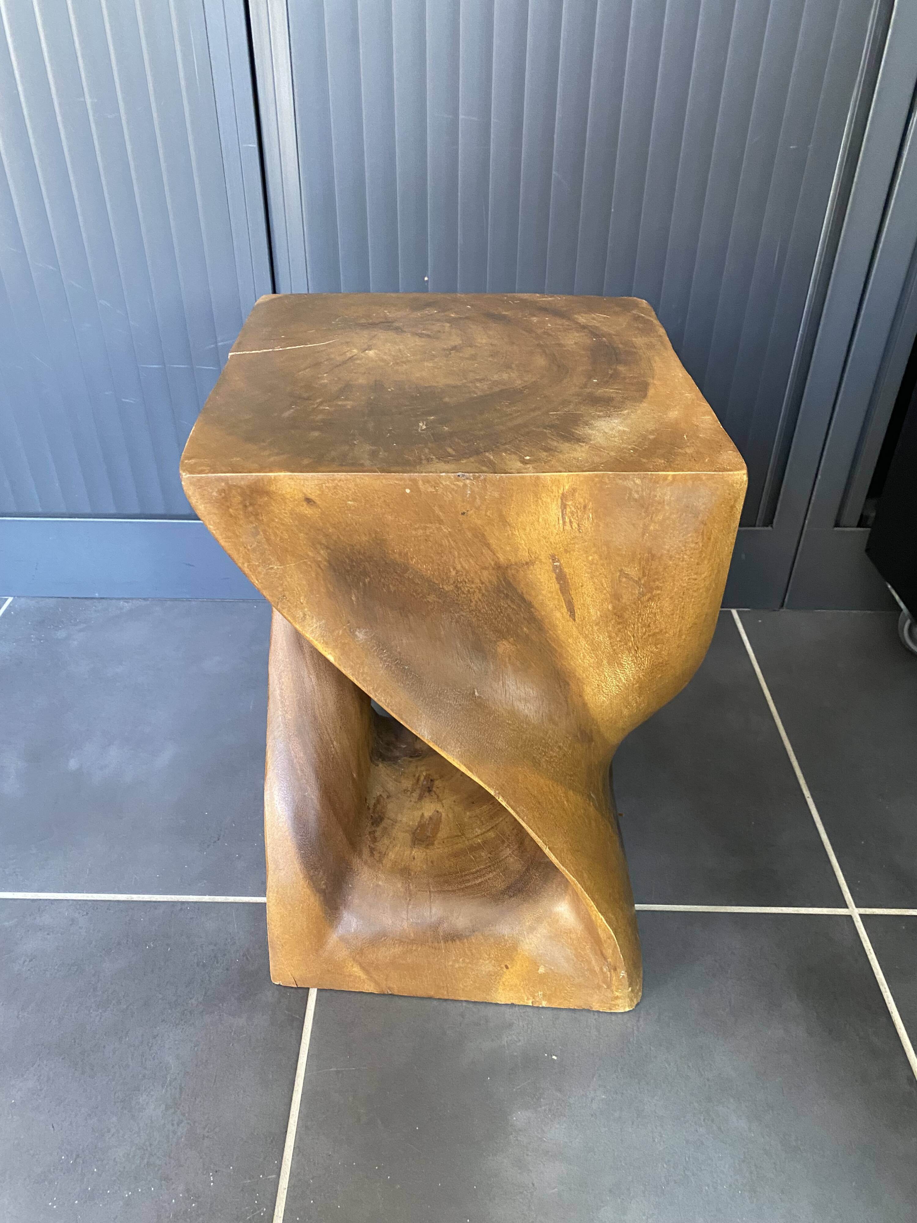 Stool no. 1 in solid raw walnut wood, carved from the mass, 1970.