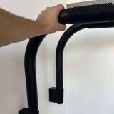 Pair of vintage wall lights, tubular and perforated black metal, Parscot France 1980