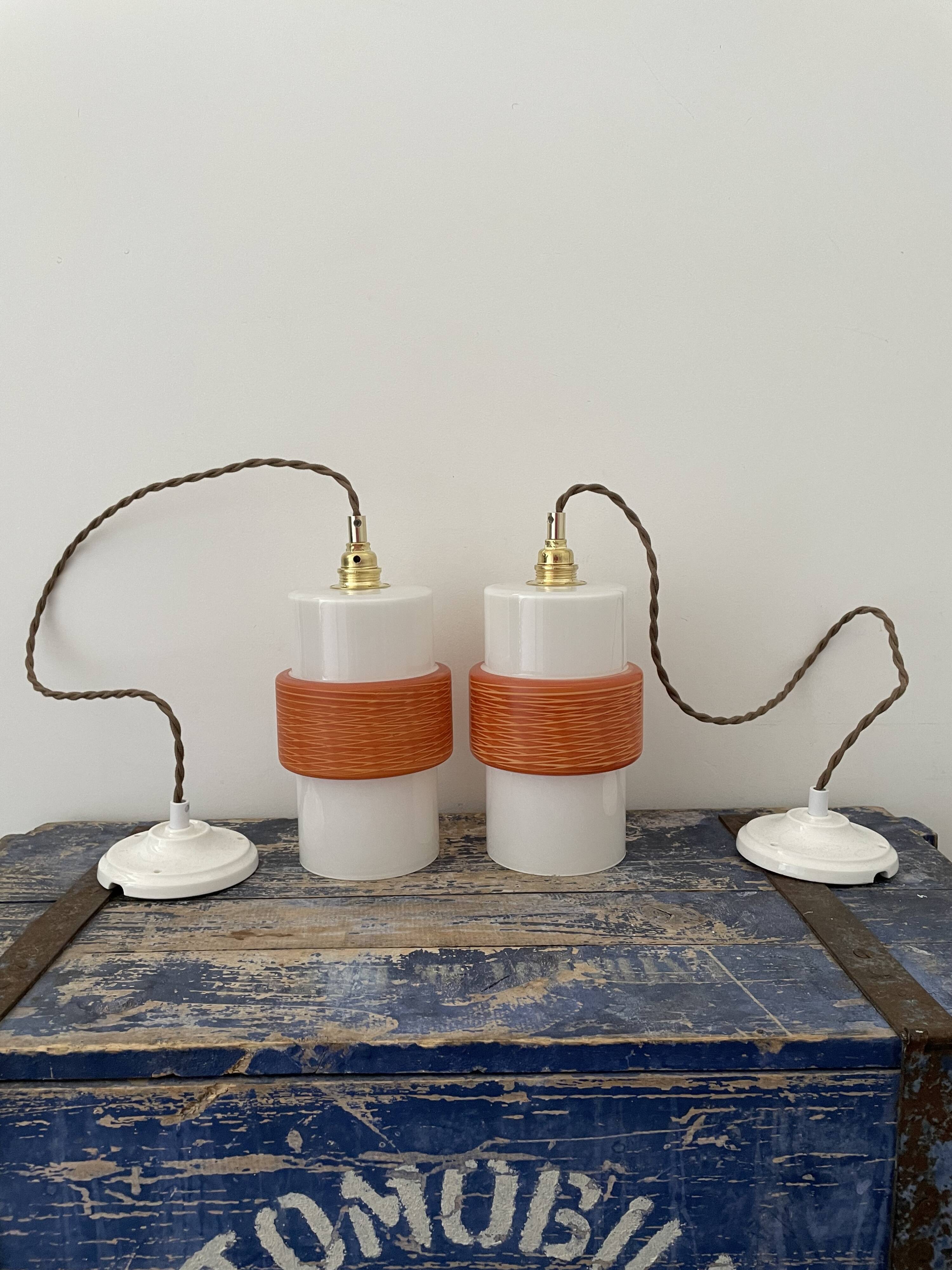 Pair of vintage suspensions electrified to nine