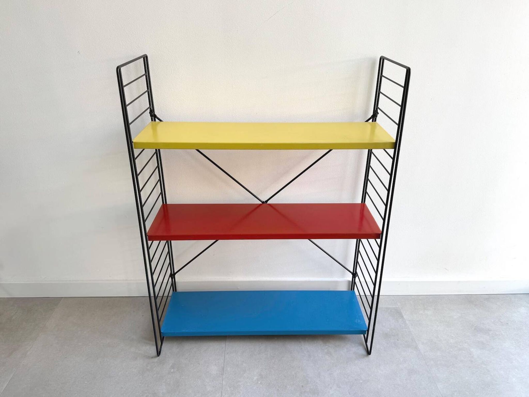 Early free standing Tomado bookshelves / shelving cabinet designed by D. De