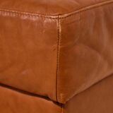 Ottoman with leather upholstery