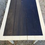 Table/desk with beige patinated square legs and black top