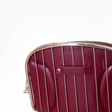 Dark red leather hairdresser's chair