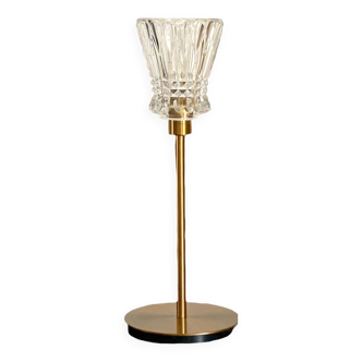 Table lamp with a crystal glass lampshade, like a vase and a golden base