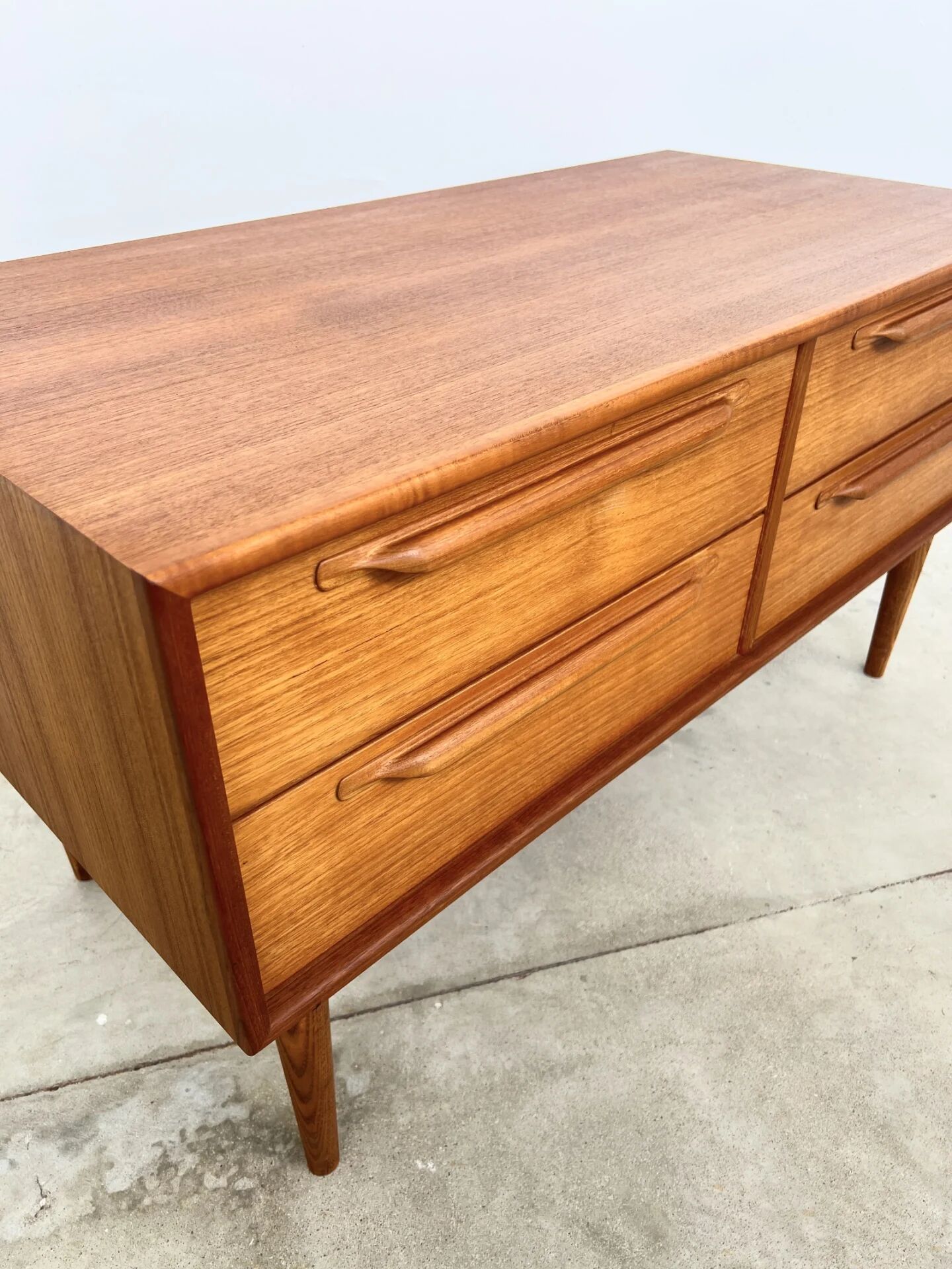 Lowboard teak 4 drawers — Mid-century lines, tapered legs, 1960s