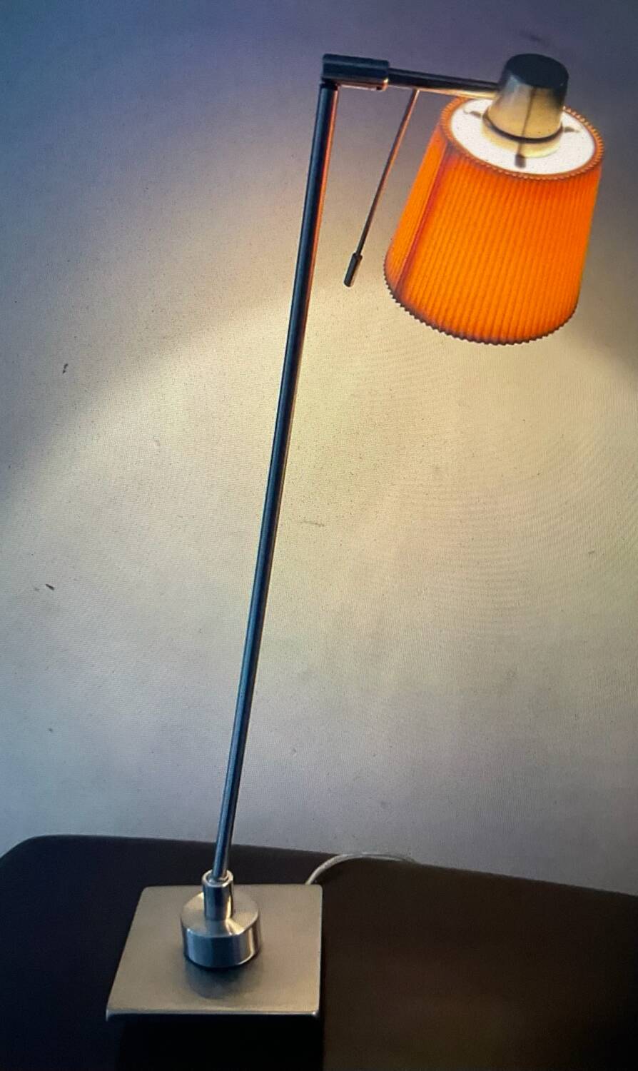 Articulated designer lamp in brushed stainless steel