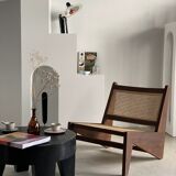 Reclined armchair in canned teak in natural wood