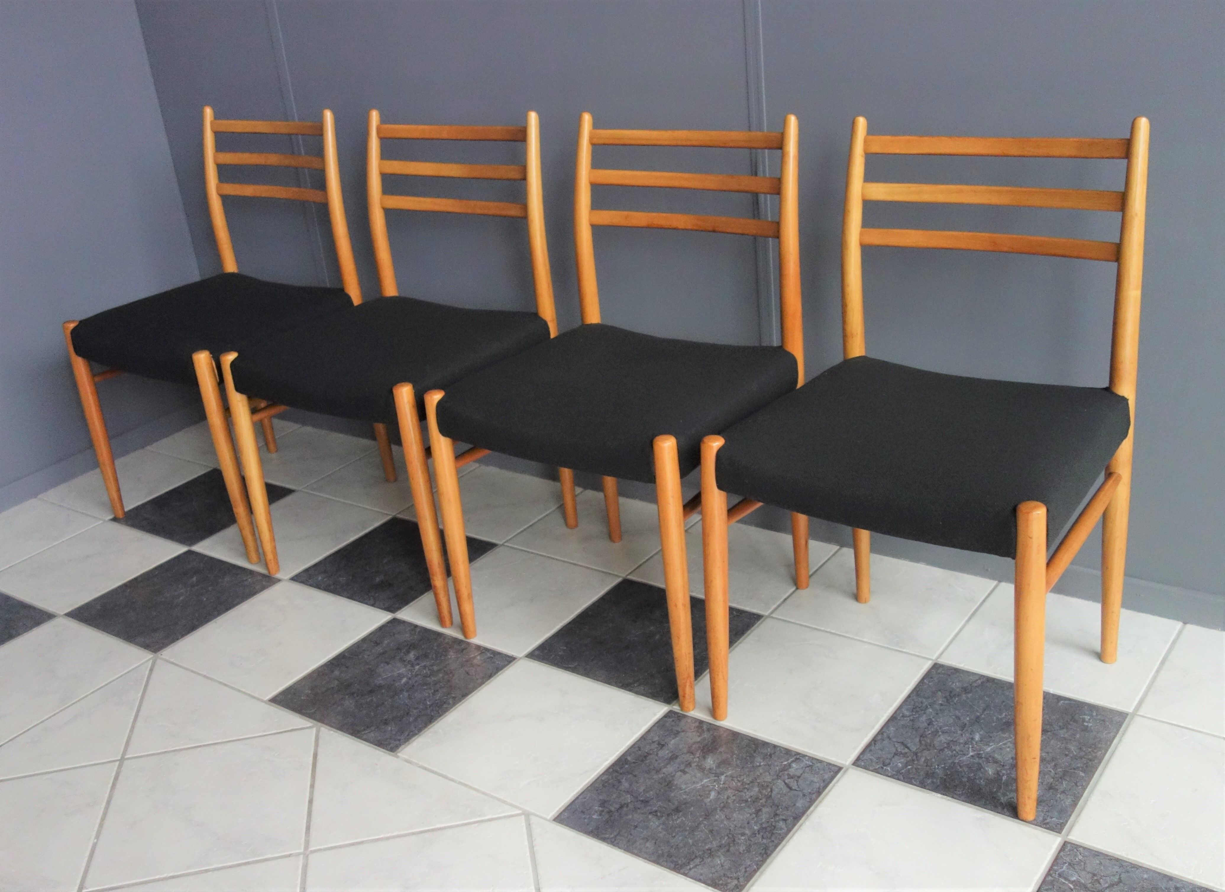 Set of 4 dining chairs in wood and black fabric 1960s