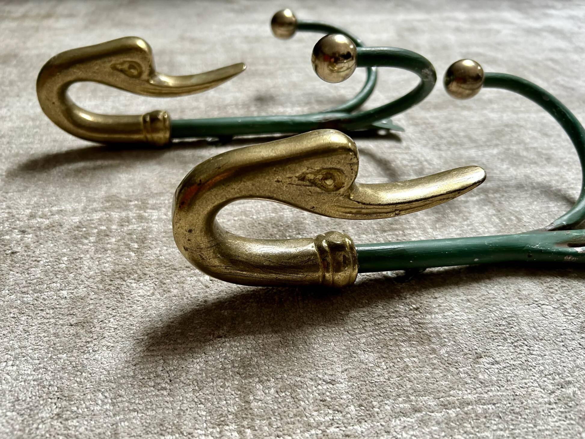 Rare set of swan neck coat hooks with mirror frame attributed to Maison Jansen, France, 1950s.