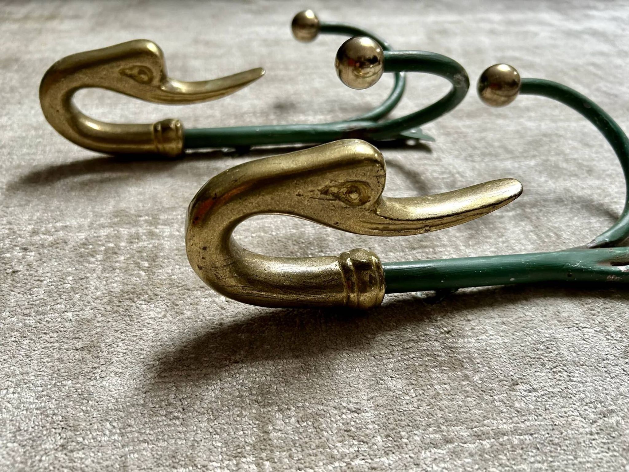 Rare set of swan neck coat hooks with mirror frame attributed to Maison Jansen, France, 1950s.