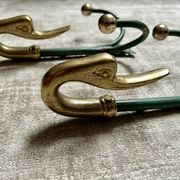 Rare set of swan neck coat hooks with mirror frame attributed to Maison Jansen, France, 1950s.