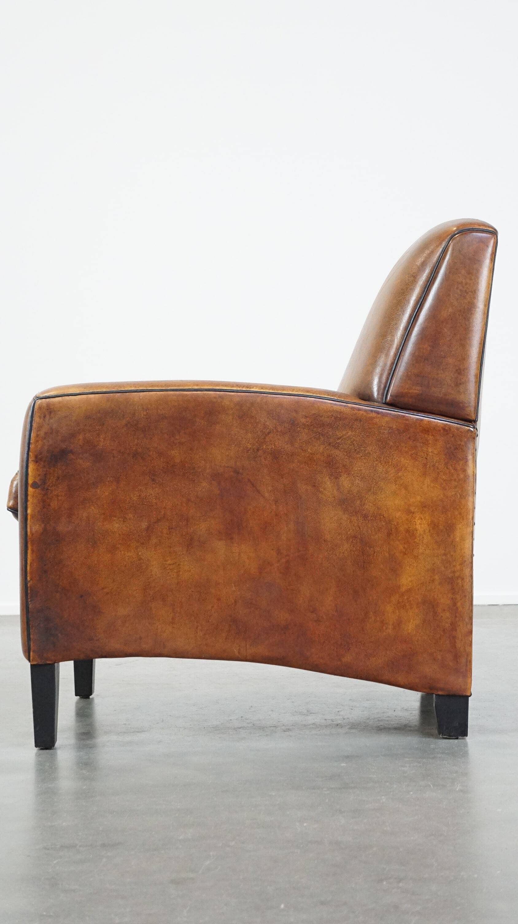 Art Deco sheep leather armchair with a lot of character
