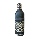 Leather bottle and braided straw