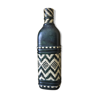 Leather bottle and braided straw