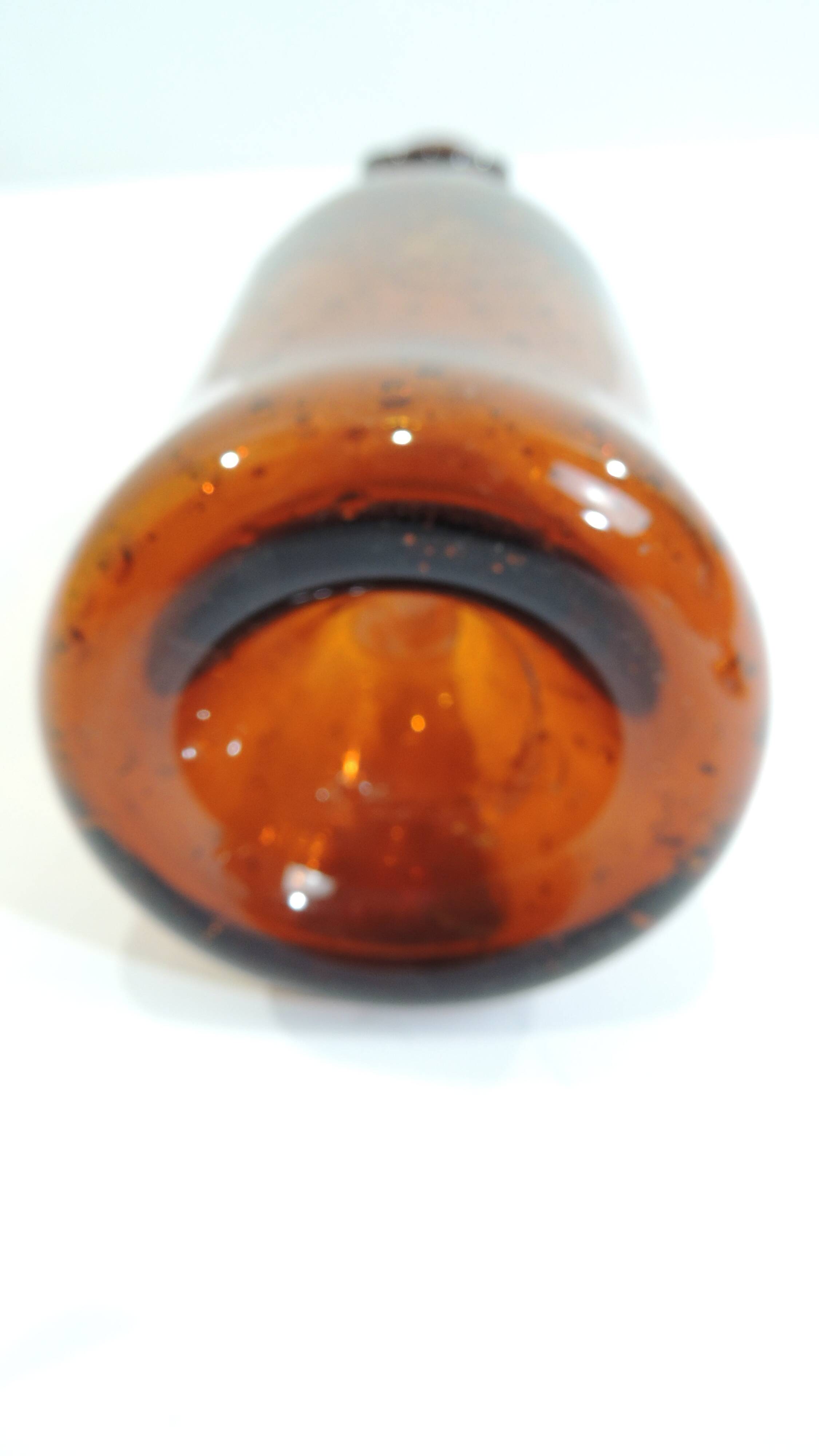 Amber bottle in bubbled blown glass, signed Biot – France, vintage 1970s