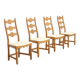 Four oak dining chairs by Henning Kjaernulf.