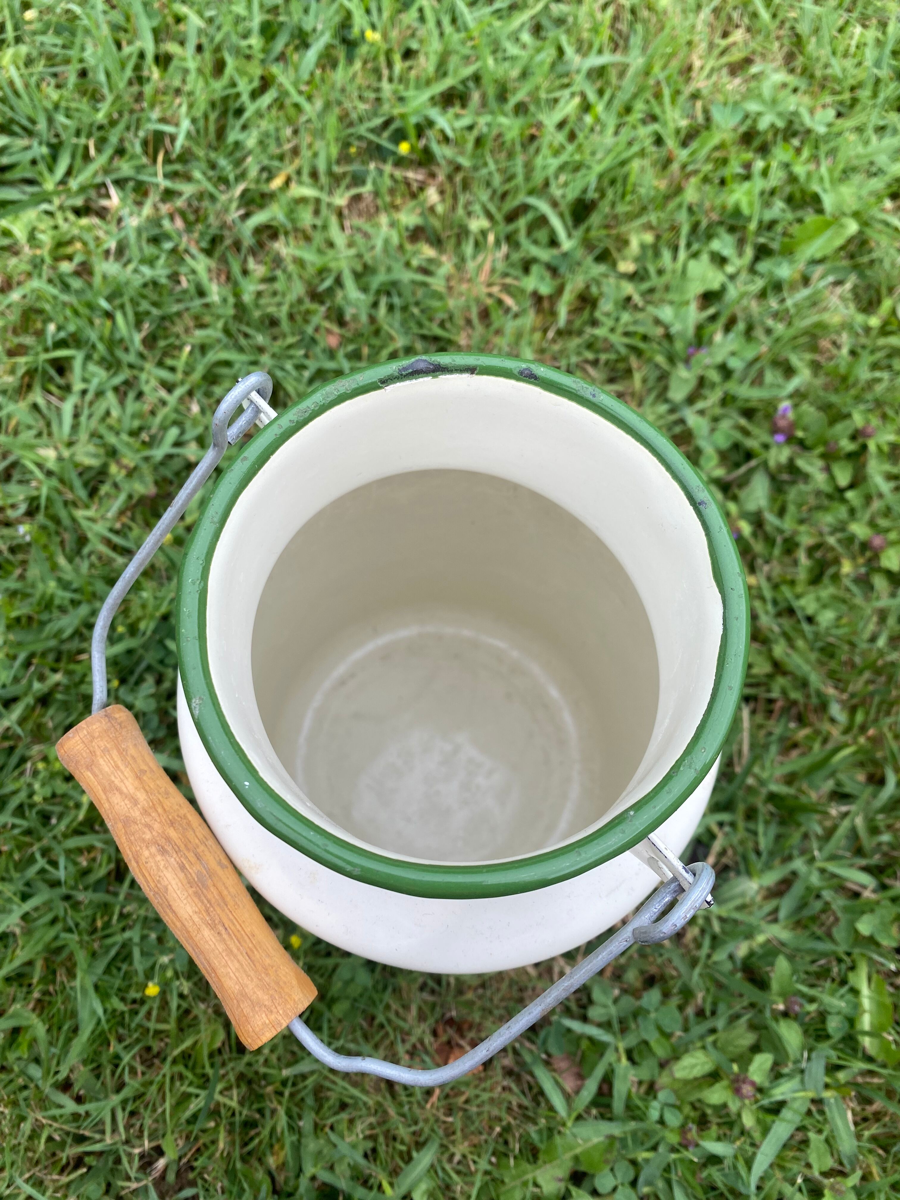 Enamelled old milk pot