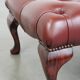 In very good condition elegant red/brown chesterfield ottoman made of cow leather