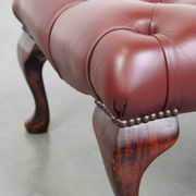 In very good condition elegant red/brown chesterfield ottoman made of cow leather