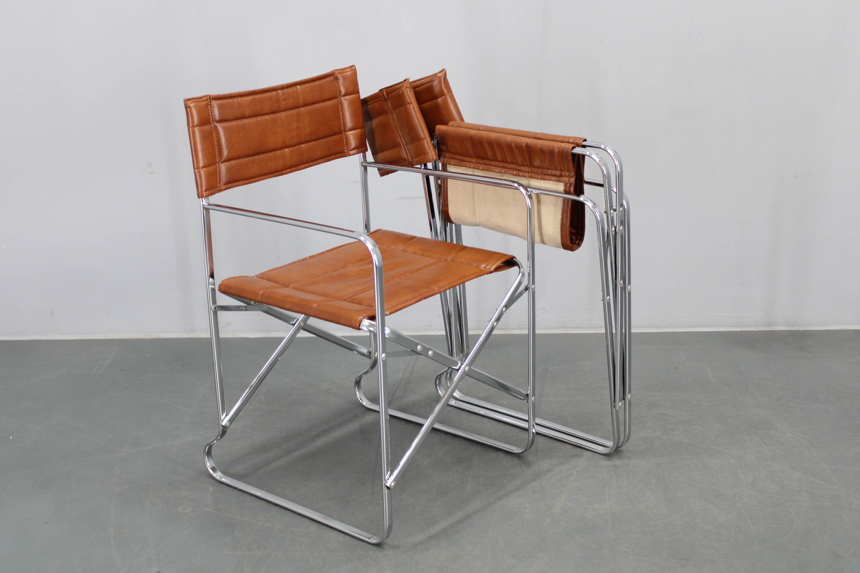 1970s pair of Italian folding chairs with leatherette upholstery