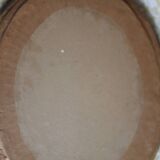 Oval wall mirror with gilded frame and mercury glass. Late 19th-early 20th century.