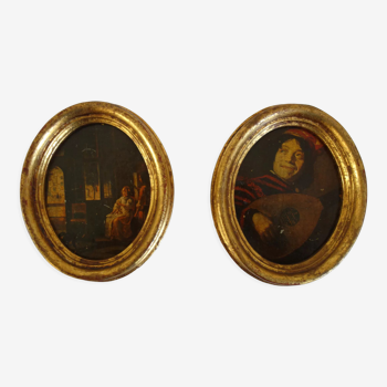 Set of 2 paintings in oval frames