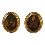 Set of 2 paintings in oval frames