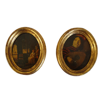 Set of 2 paintings in oval frames