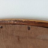 Antique oval mirror with beveled glass in wood and stucco, 19th century