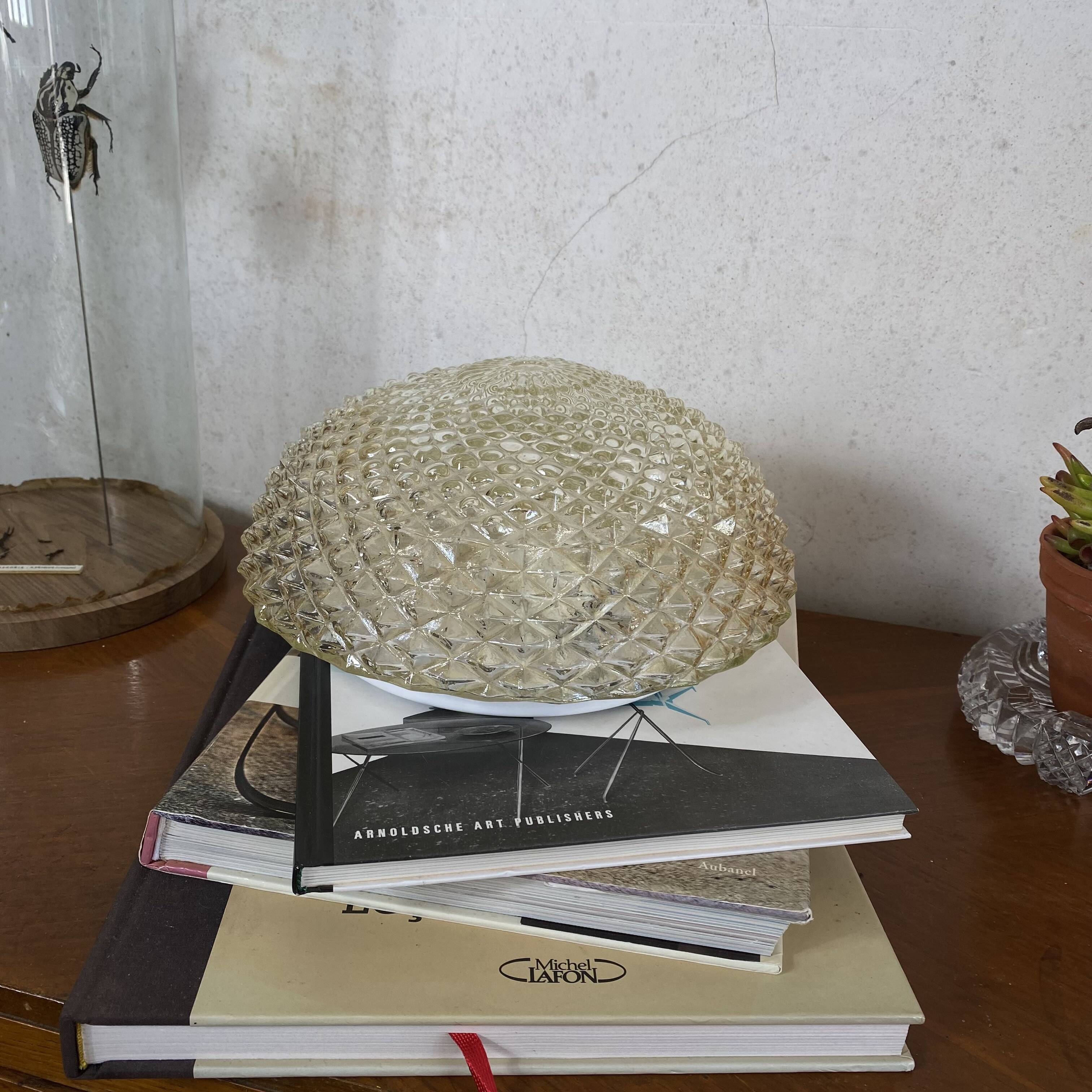 Amber glass wall light or ceiling light with a diamond tip.