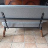 Two-seater sofa in fabric, metal and wooden armrests