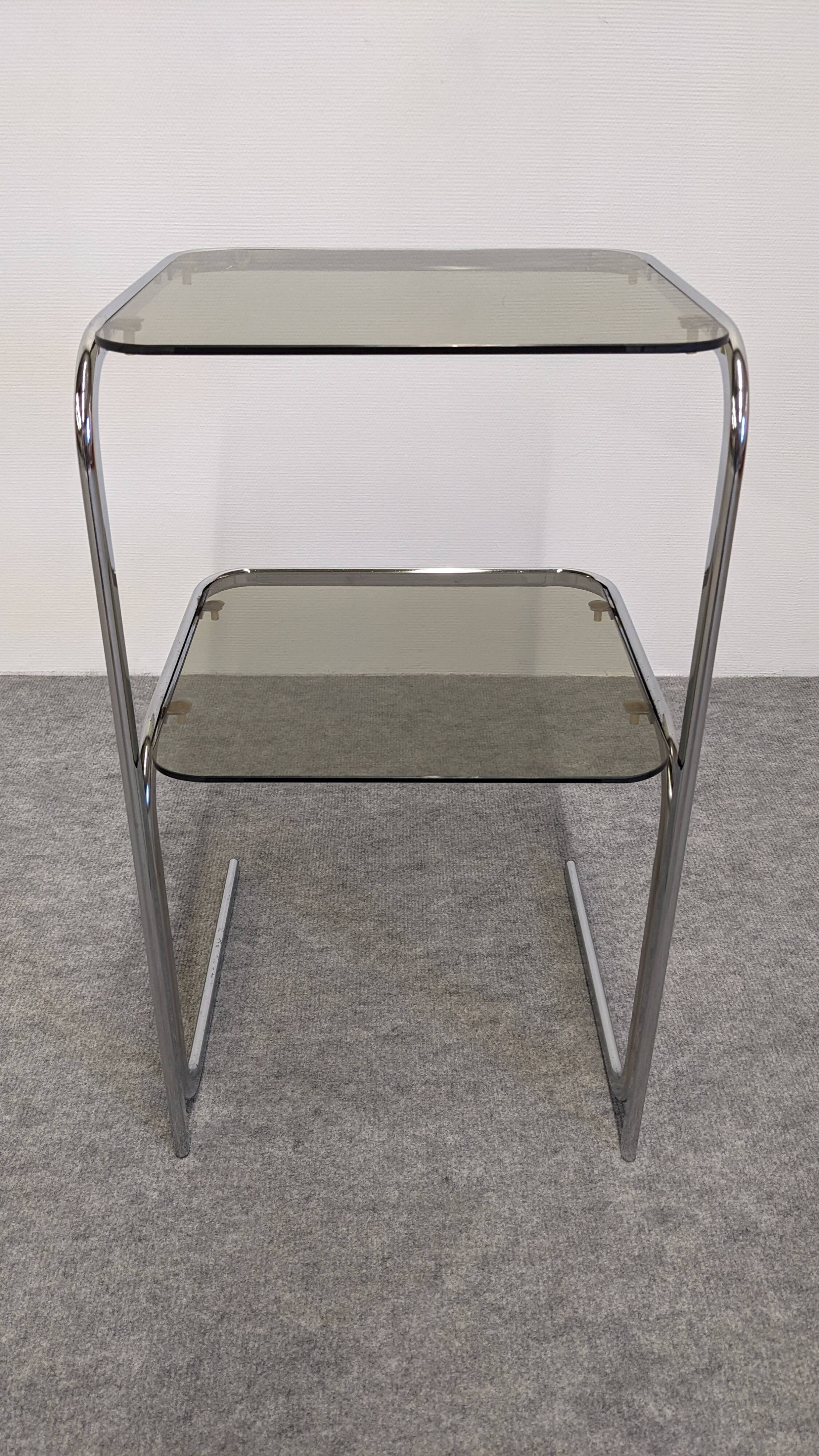 Chrome and smoked glass side table or end table, France circa 1970.