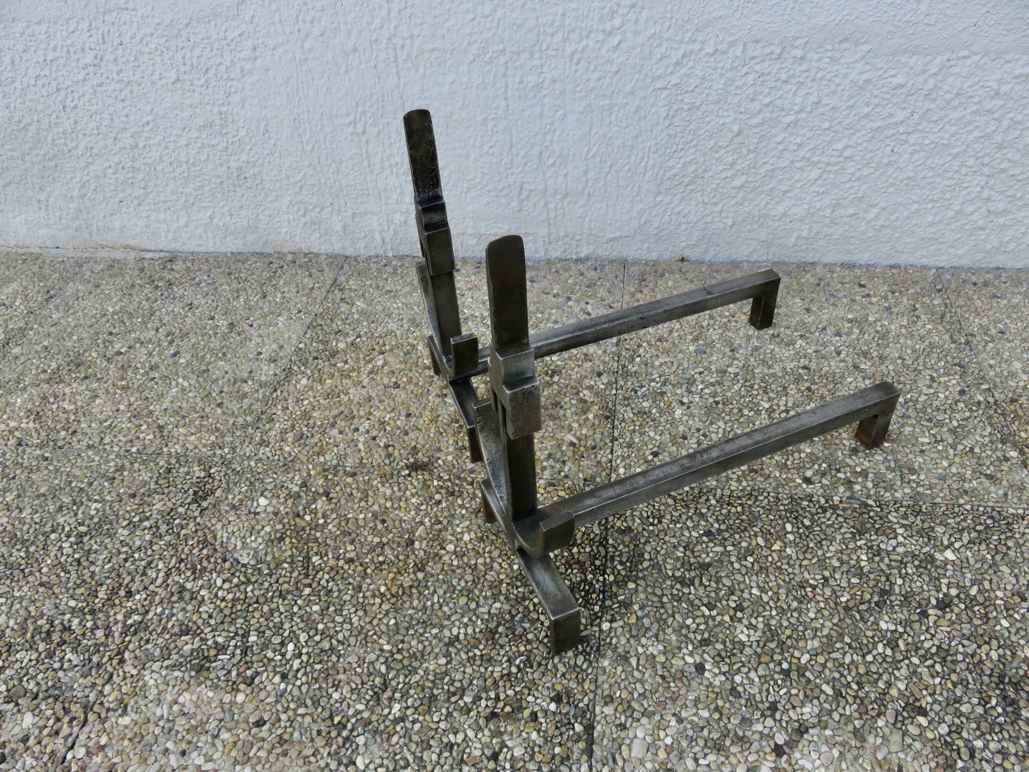 Pair of modernist andirons in forged and hammered steel, French work