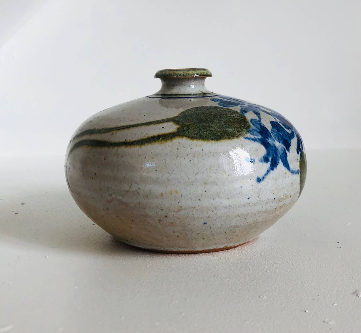 Ceramic bud vase with floral decoration