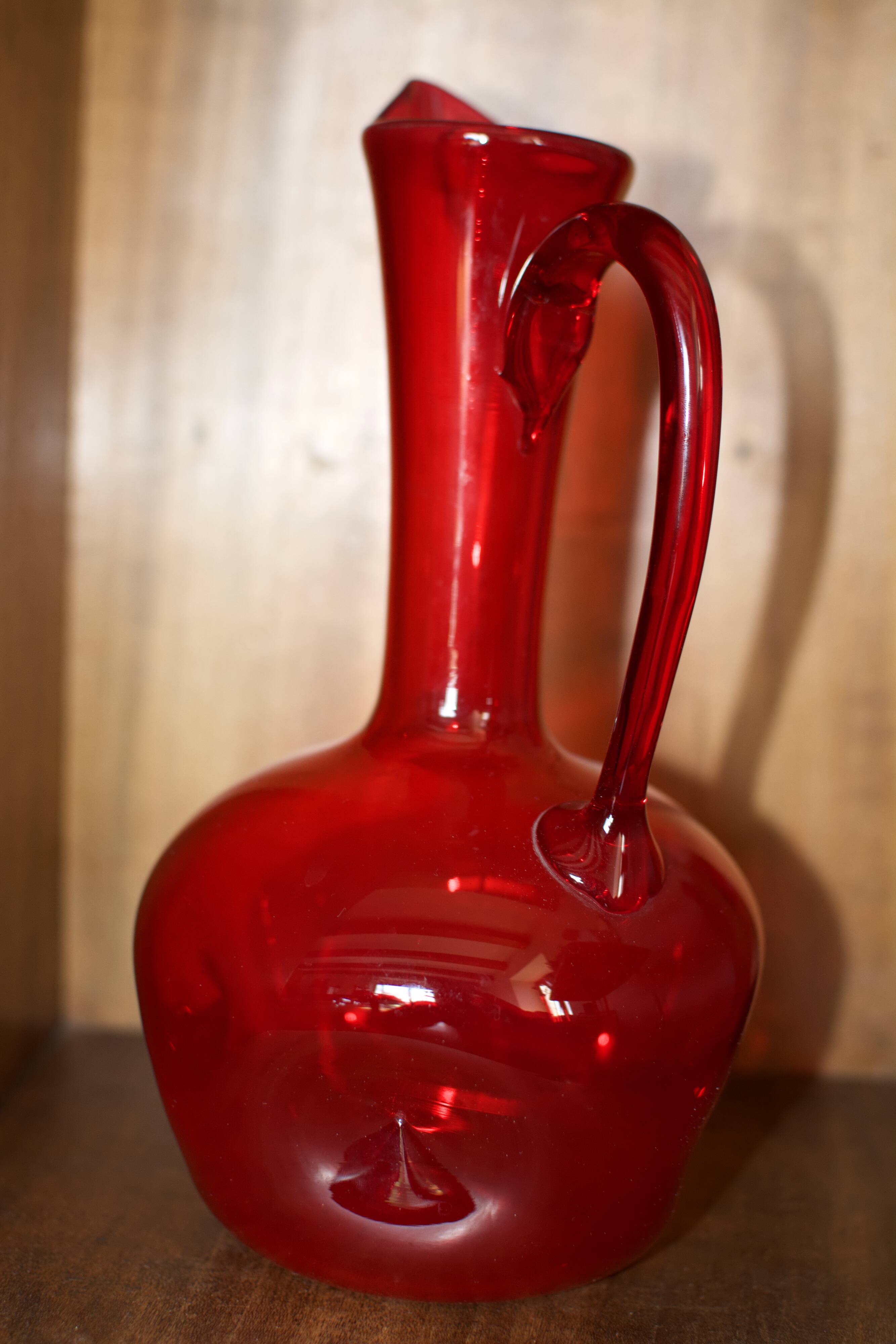 Pair of vintage blown glass pitchers
