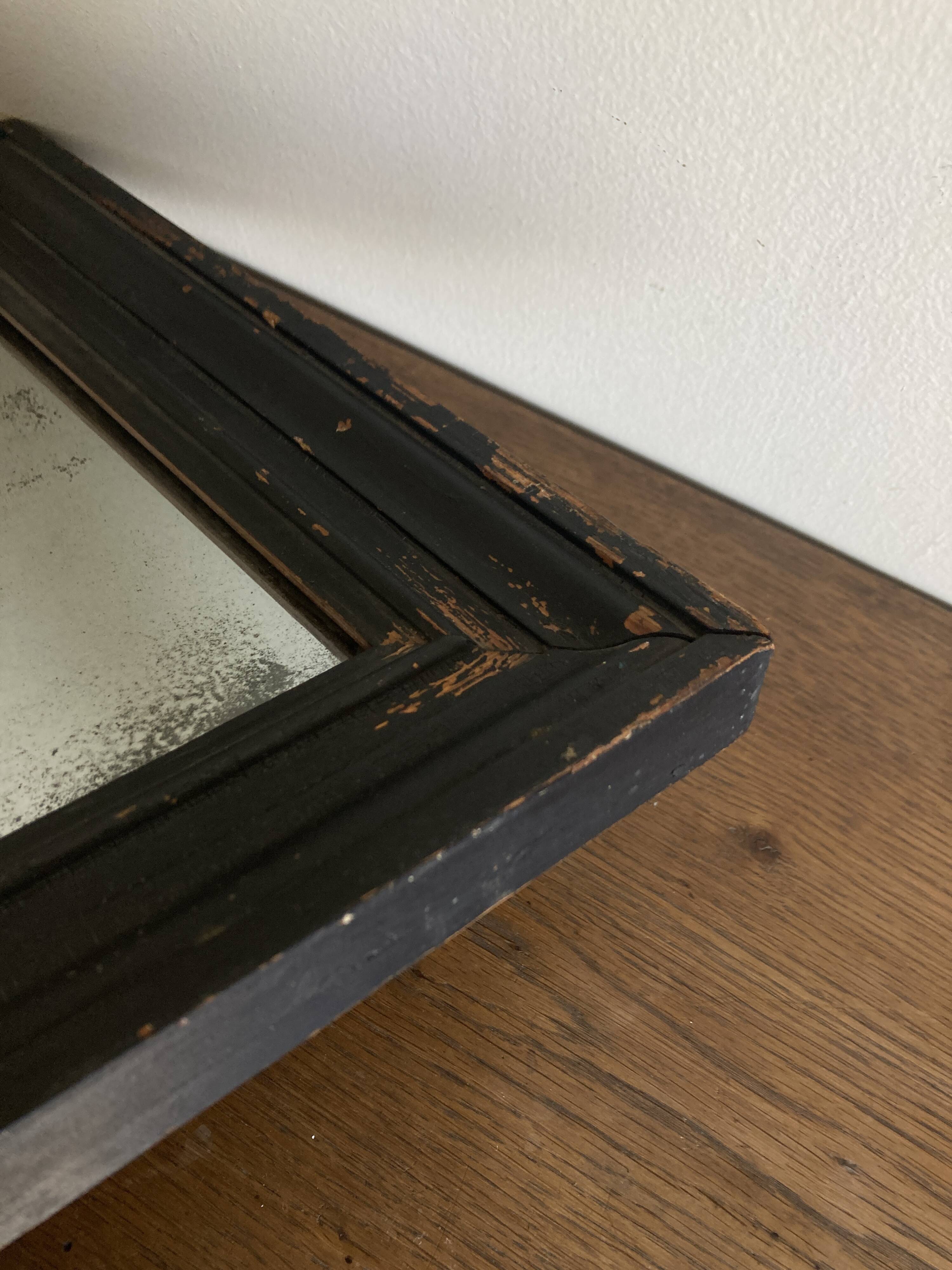 19th century blackened mirror with pitted glass 34cm x 40cm