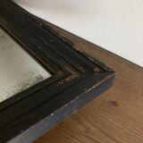 19th century blackened mirror with pitted glass 34cm x 40cm