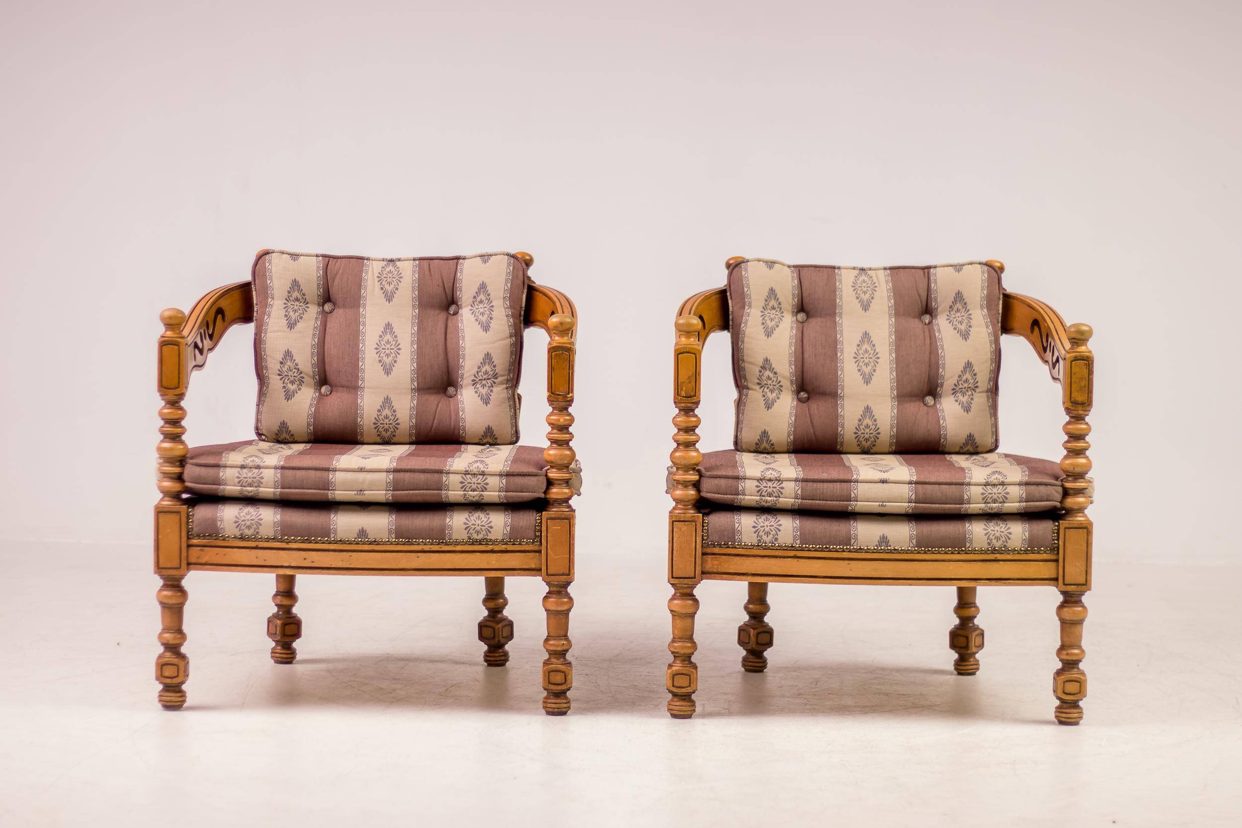 Pair of Giorgetti "1975 Gallery" armchairs in carved wood, original upholstery.