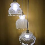 Original suspension of three vintage transparent glass globes.